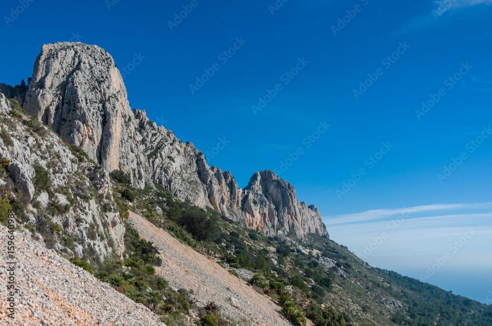 View of peaks of Sierra de Bernia mountains range, near Benidorm, Spain.