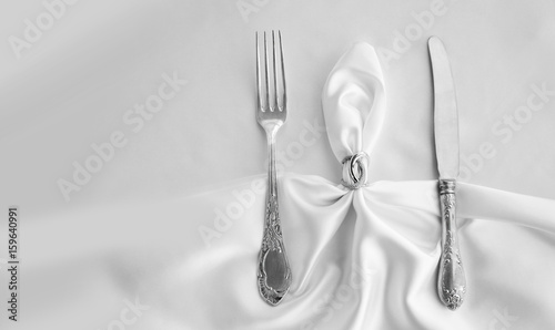 Vintage cutlery on white lace
