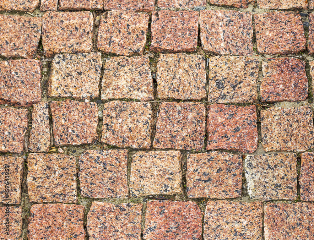 Fototapeta premium Texture of cobblestone road close-up.