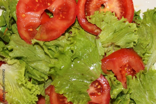 Fresh salad with tomatoes on the plate
