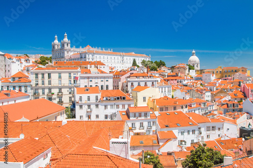  Aerial scenic view of central Lisbon Portugal with red tile roofs and monastery Igreja Sao Vicente de Fora 