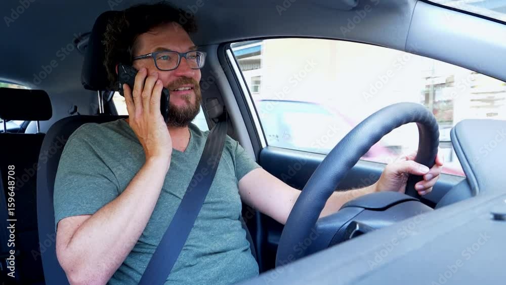 Man talking on the phone driving car creating dangerous accident