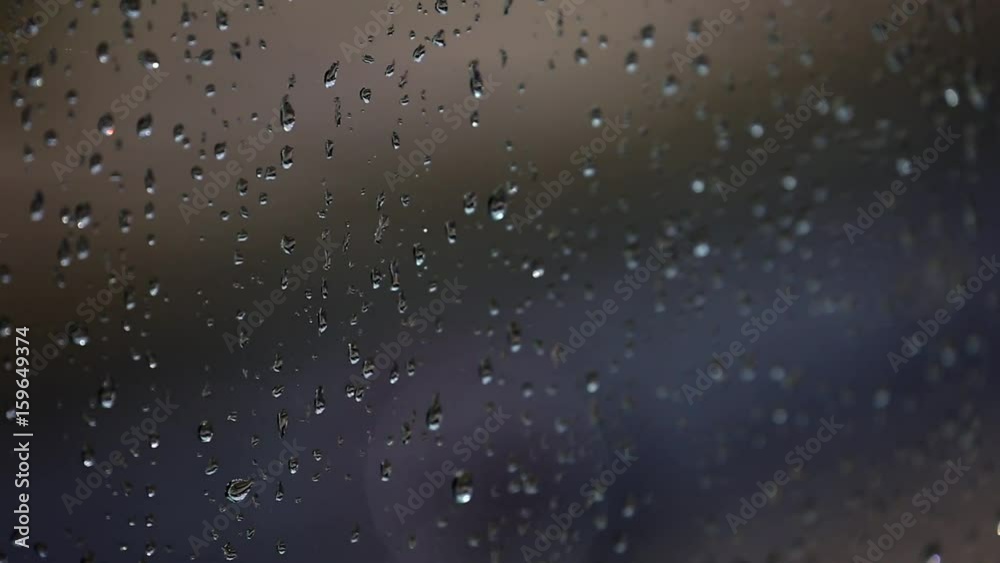 A lot of raindrops of white water falling down on glass. Perfect for digital composing. Pure black background. A lot of raindrops of white water falling down on glass. Perfect for digital composing. Pure black background.