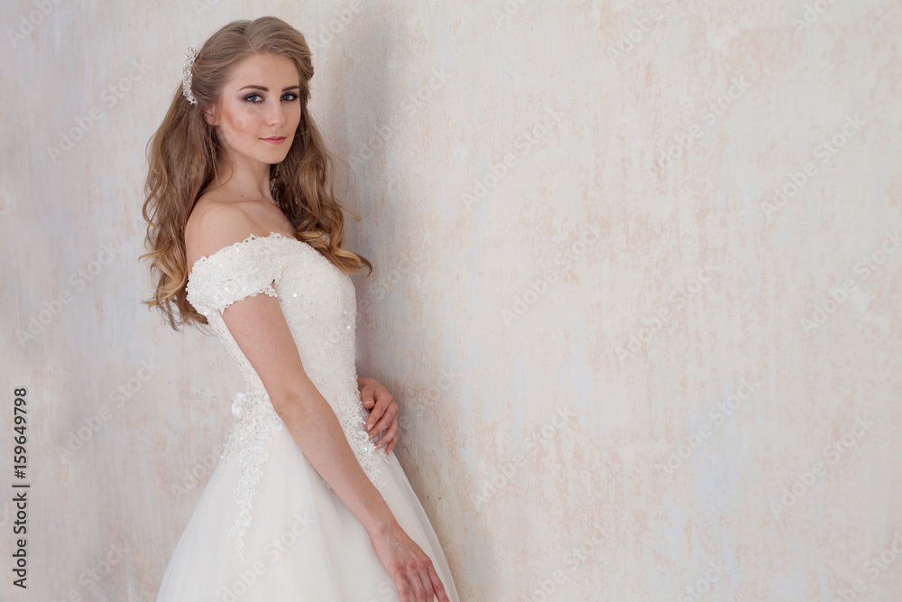 a portrait of the bride before the wedding in white dress a portrait of the bride before the wedding in white dress
