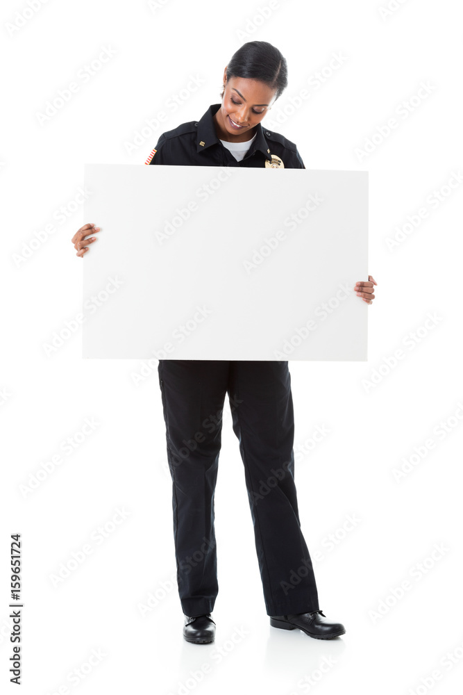 Police: Female Officer Holding White Card For Sign Police: Female Officer Holding White Card For Sign