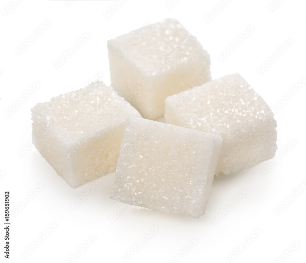 Cubes of lump sugar isolated on a white background.