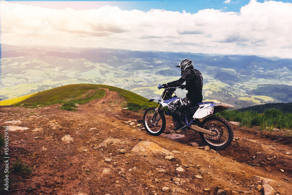 Carpathian mountains in Ukraine.Man rides a motorcycle in the mountains. Mountain range in summer Green mountain,mountain peak, mountain landscape. Carpathian mountains in Ukraine.Man rides a motorcycle in the mountains. Mountain range in summer Green mountain,mountain peak, mountain landscape.