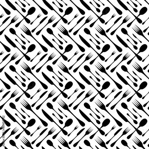 Cutlery seamless vector pattern. Silverware hand implements - spoon, knife and fork black silhouettes on white background. Restaurant and meal theme wallpaper design.
