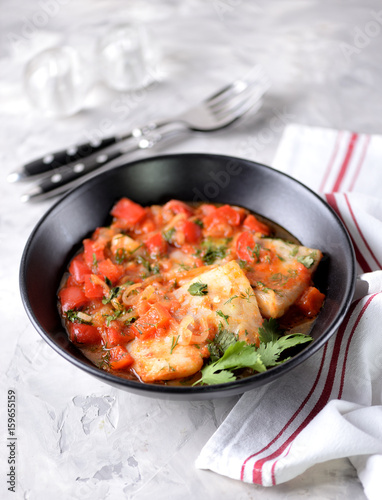 White sea fish stewed with onion, red pepper, tomatoes, garlic, coriander and cumin.