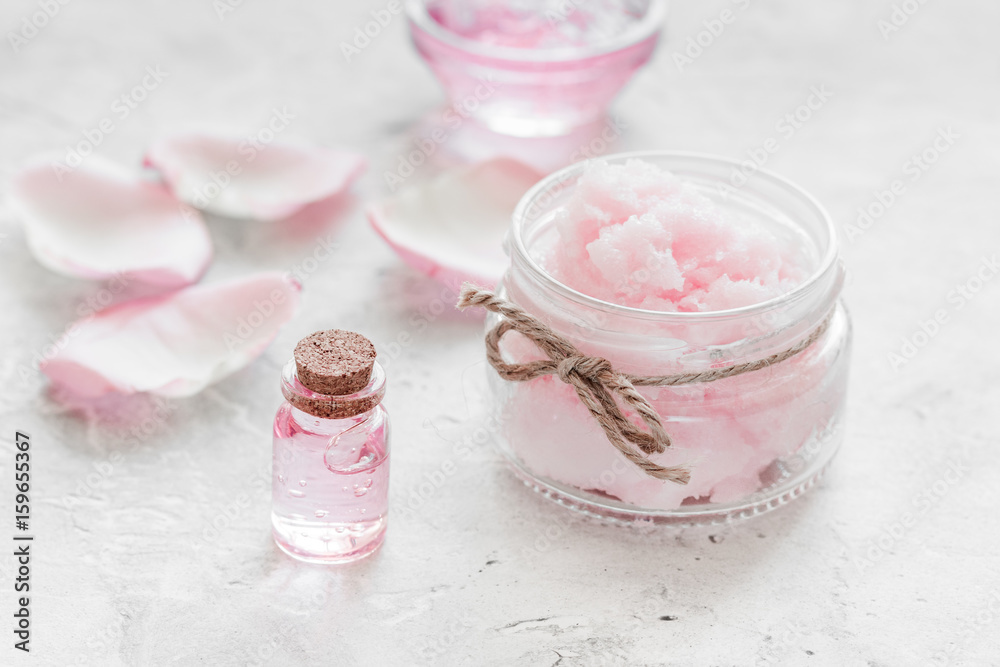 homemade spa with rose cosmetic set, cream, salt and oil on white background homemade spa with rose cosmetic set, cream, salt and oil on white background