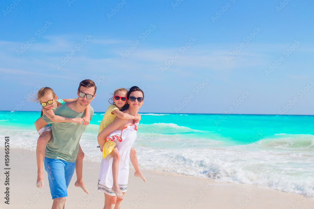 Young family on vacation have a lot of fun on the beach