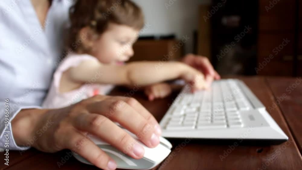 child disturbing keyboard typing child disturbing keyboard typing
