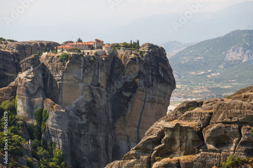 Meteora monasteries. Beautiful view on the Holy Monastery of Great Meteofo placed on the edge of high rock at sunrise, Kastraki, Greece.