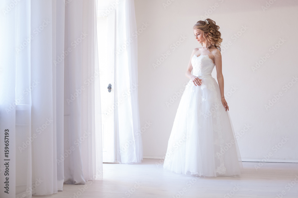 bride in white dress before wedding