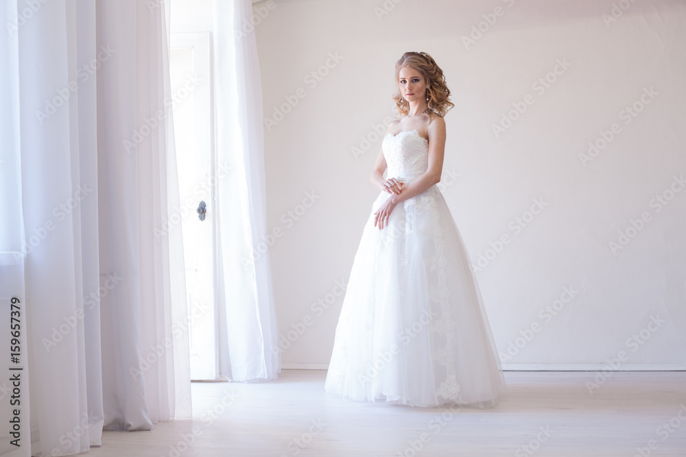bride in white dress before wedding