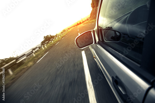 A car driving on a motorway at high speeds photo
