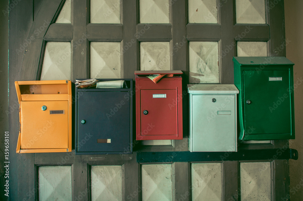 old vintage colorful post boxes, multicolored mailboxes