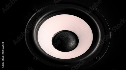 Close up at moving sub-woofer. Speaker part. Black and yellow colors of membrane. Concept of musical instrument. macro video shot.
