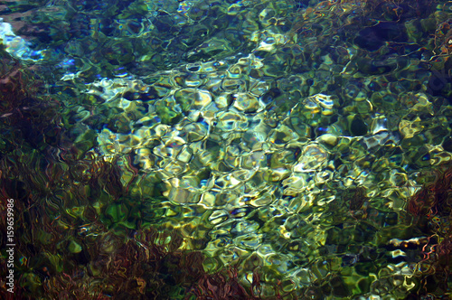 Fototapeta Naklejka Na Ścianę i Meble -  ripples in spring fed pond Te Waikoropupu Springs NZ