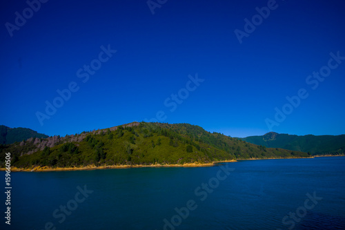 Beautiful landscape with gorgeous blue sky in a sunny day seen from ferry from north island to south island, in New Zealand