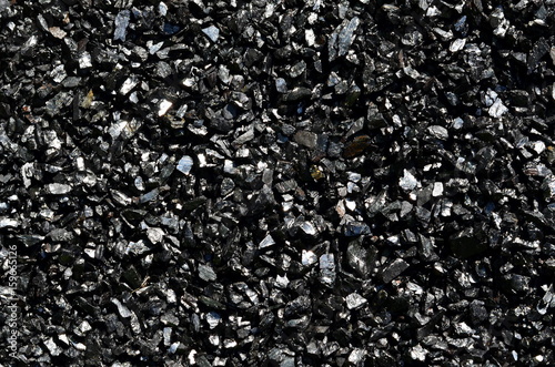 Fotografia Background of fine shiny charcoal of anthracite coal close-up.