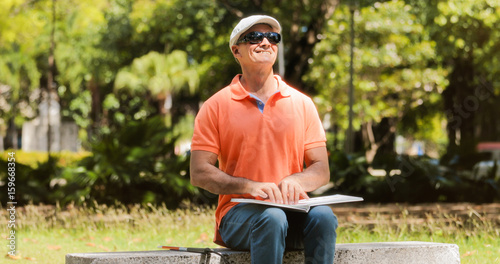 Handicapped People With Disability Blind Man Reading Braille Book