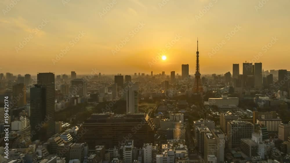 4k time lapse of day to night sunset scene at Tokyo city skyline with Tokyo Tower. Tilt down