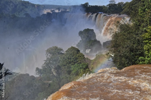 The Iguazu Falls  Iguaz   Falls  Iguassu Falls  or Igua  u Falls  on the Iguazu River on the border of the Argentine province of Misiones and the Brazilian state of Paran  . 