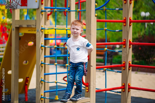 Little boy playing on the playground.