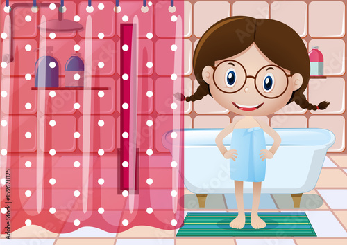 Little girl in bathtowel taking bath