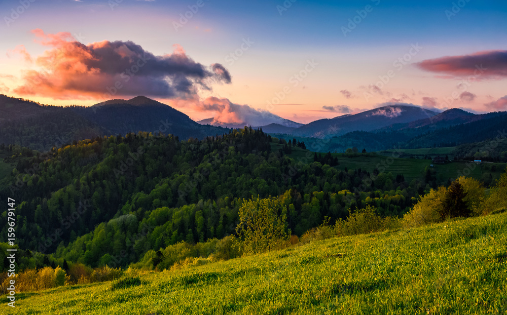 mountain rural area in springtime at cloudy sunset mountain rural area in springtime at cloudy sunset