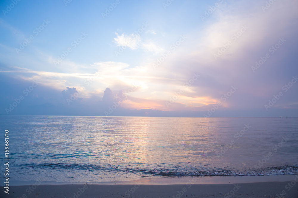 Beautiful sky, sunrise and waves at the beach Beautiful sky, sunrise and waves at the beach