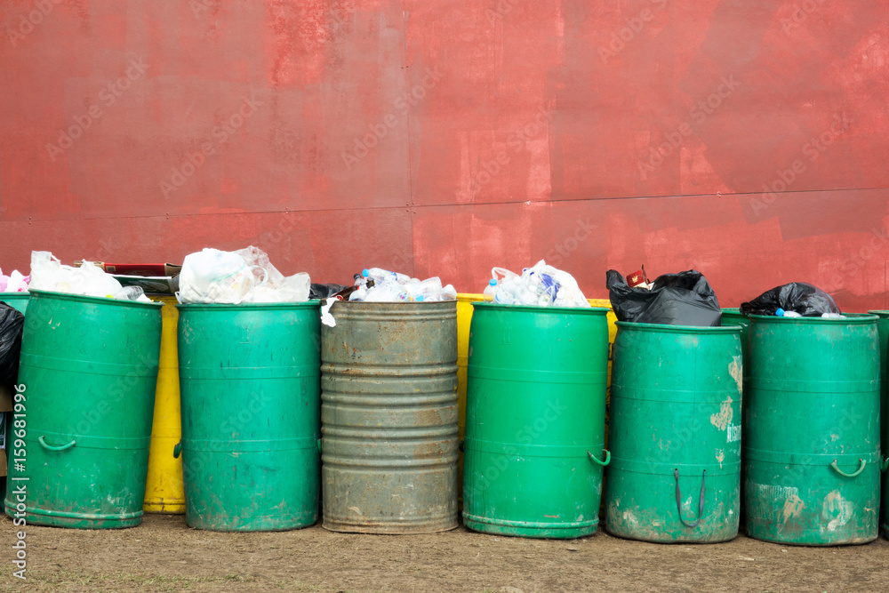 Trash garbage full of bags container in street Trash garbage full of bags container in street