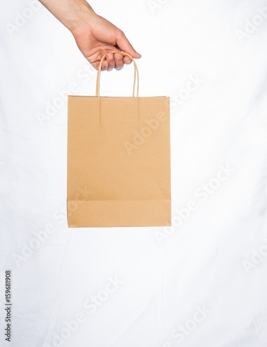 Hand carrying blank paper bag