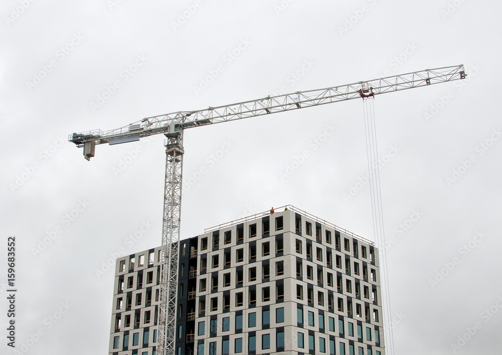 Industrial construction crane in the city.