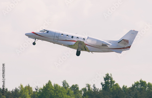 Small commercial airplane taking off.