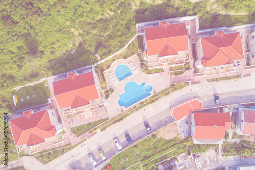 Top view of houses with a swimming pool. Toned
