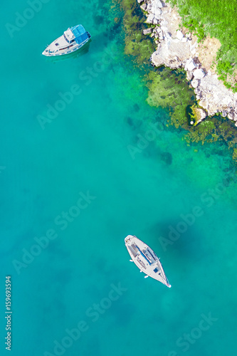 White boats in the sea near the shore © watman