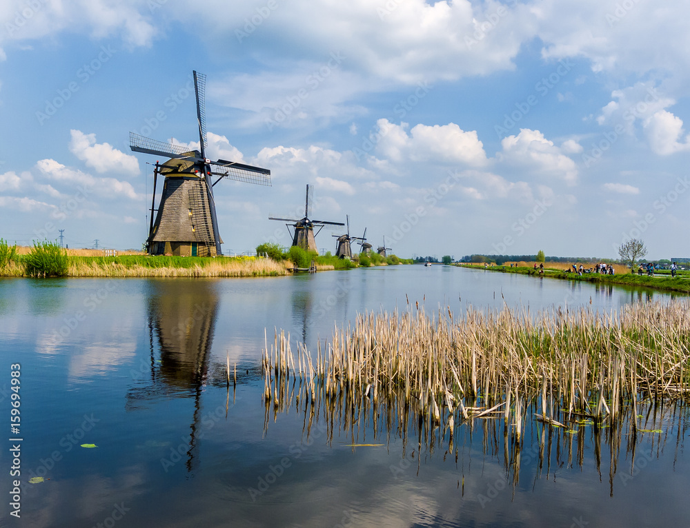 The famous windmills of Kinderdijk, Holland on a beautiful spring day.