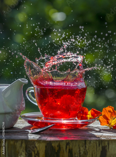 fruity tea splash on the garden table