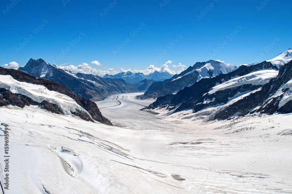 Glacier between rocks and high mountains - Jungfraujoch, Switzerland