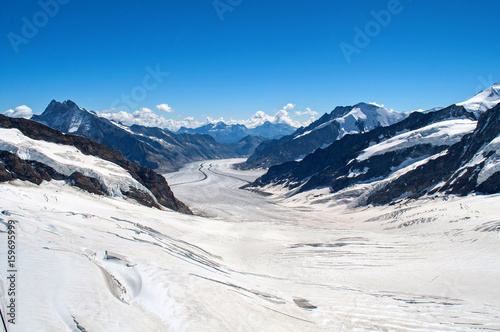 Glacier between rocks and high mountains - Jungfraujoch, Switzerland