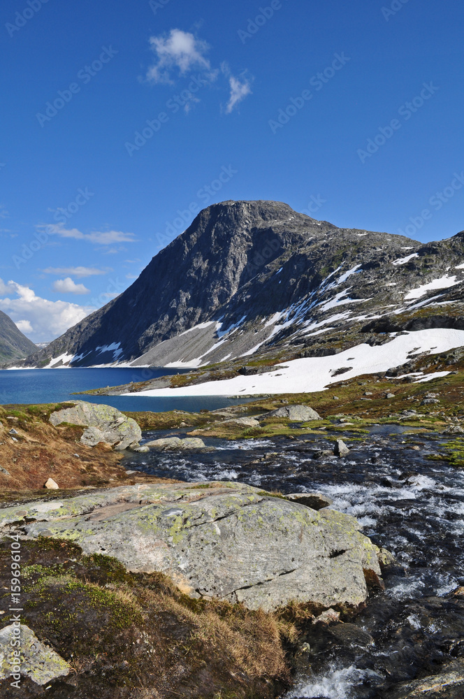 Dalsnibba mountain above Geiranger town in Norway with snow and lake. Dalsnibba mountain above Geiranger town in Norway with snow and lake.