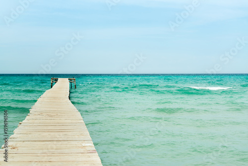 View from a wooden pier over the ocean © KariDesign