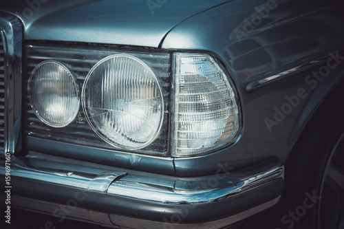Fotografie Headlights and body of an old classic car at an exhibition of vintage cars