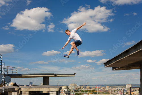 Man jumps from roof to roof. Parkour