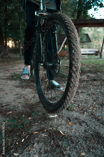 Mountain bike on a forest road in the evening.