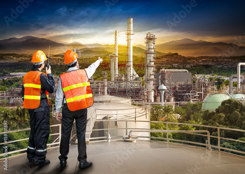 Engineer survey of oil refiner photo