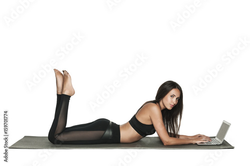 Young brunette woman working on her laptop