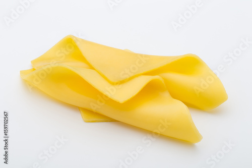 Cheese slices on white background cutout.
